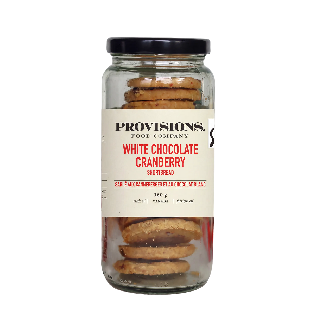 A glass jar of Provisions Food Company White Chocolate Cranberry Shortbread with a black lid and cream-colored label, set against a plain white background.