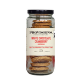 A glass jar of Provisions Food Company White Chocolate Cranberry Shortbread with a black lid and cream-colored label, set against a plain white background.